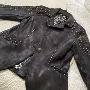 Edgy black jacket with striking stud detailing!